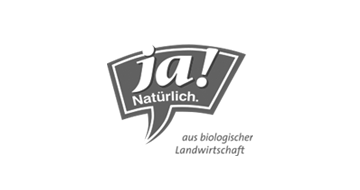 Ja Natürlich Logo in grau mit dem Schriftzug aus biologischer Landwirtschaft